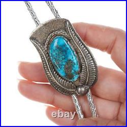 Vintage Native American Sterling and turquoise bolo tie with silver cord